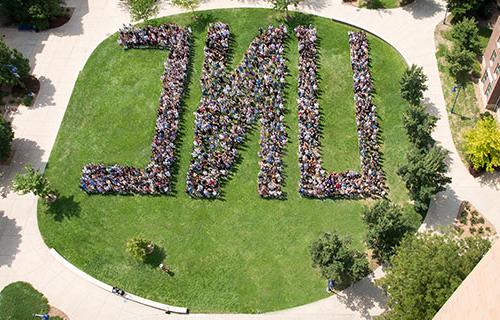 Aerial photo of students forming the letters U-N-C