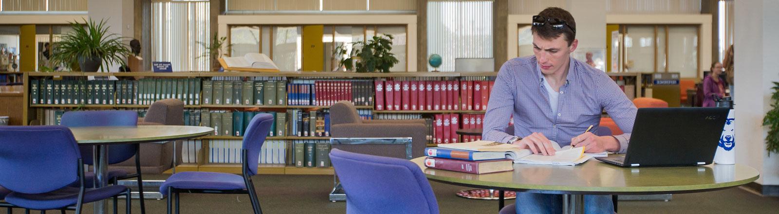 Intensive English Program Student studying in Michener Library